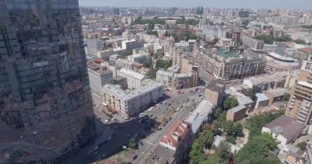 KYIV - Glass skyscraper 2 July 2017. Aerial rising shot of reflective office skyscraper details in a modern business district. Cityscape, skyscraper, building, downtown, business center, outdoor. - Filmati, video