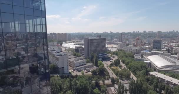 KYIV - Glass skyscraper 2 July 2017. Aerial rising shot of reflective office skyscraper details in a modern business district. Cityscape, skyscraper, building, downtown, business center, outdoor. - Video
