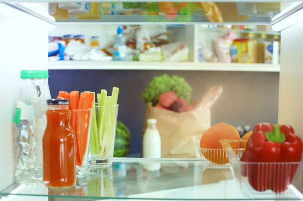 Open refrigerator with fresh fruits and vegetable. Open refrigerator - Φωτογραφία, εικόνα