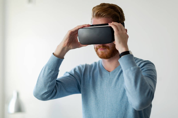 Man wearing virtual reality headset - Fotoğraf, Görsel