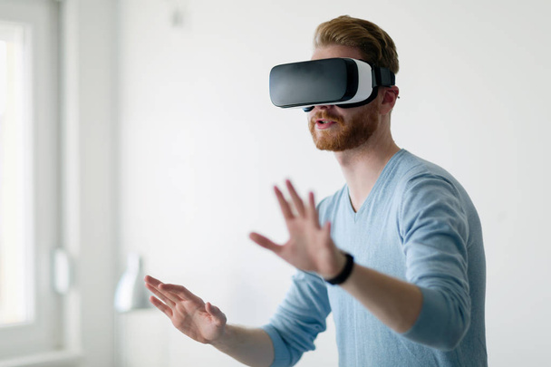 Man wearing virtual reality headset - Fotoğraf, Görsel