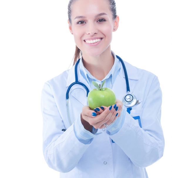 Smiling woman doctor with a green apple - Foto, immagini