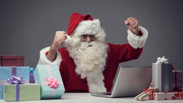 Santa connecting with his laptop  - Valokuva, kuva