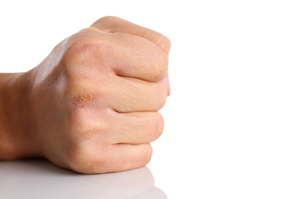 Чоловічий згорнутий кулак ізольований на білому тлі
 - Фото, зображення