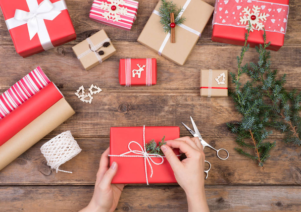 Packing Christmas presents on wooden table, top view  - 写真・画像