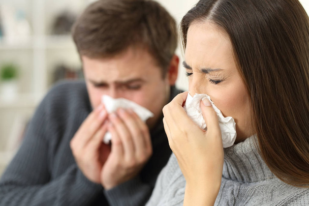 Ill couple coughing at home - Foto, imagen
