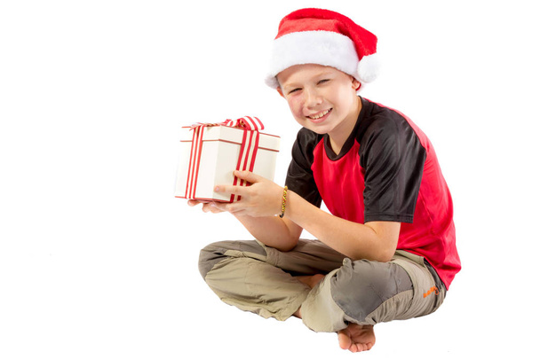 Pre-teen boy with a christmas gift - Photo, image