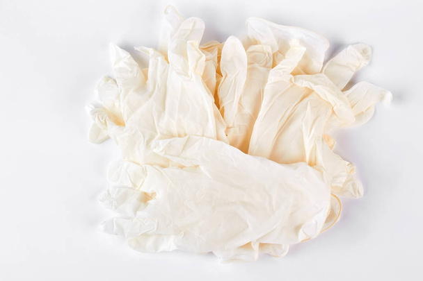 Pile of white medical gloves. - Foto, afbeelding