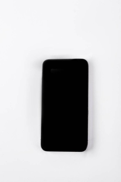 Black smartphone, top view. - Фото, изображение