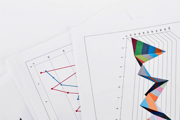 Document with colorful diagrams, white background. - Photo, Image