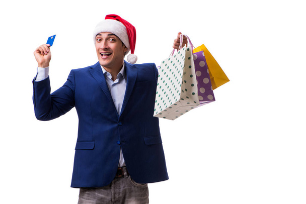 Young man with bags after christmas shopping on white background - Photo, Image