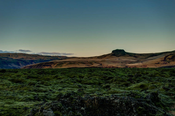 Iceland Landscape with green moss and view towards mountains dar - Foto, Imagem