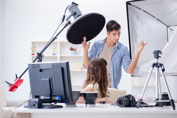 Young photographer working in photo studio - Photo, Image