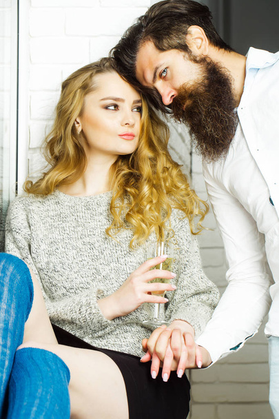 Woman with glass of wine look at bearded man - Φωτογραφία, εικόνα