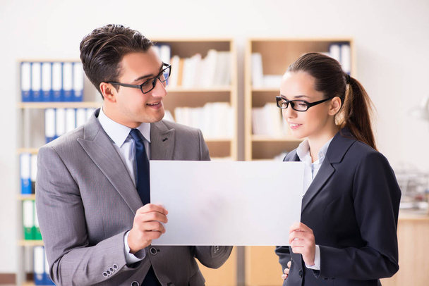 Businessman and businesswoman having discussion in office - Photo, Image