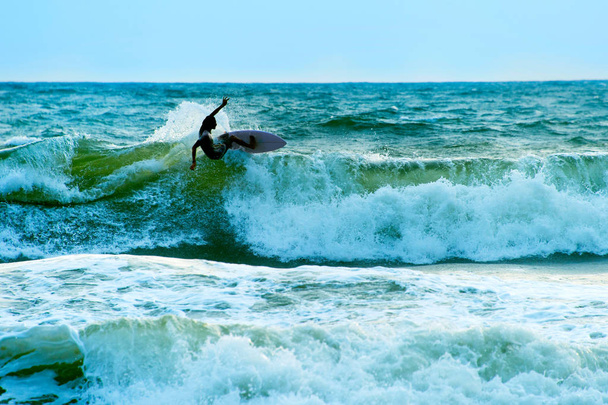 Surfer in the ocean. Bali - Fotó, kép