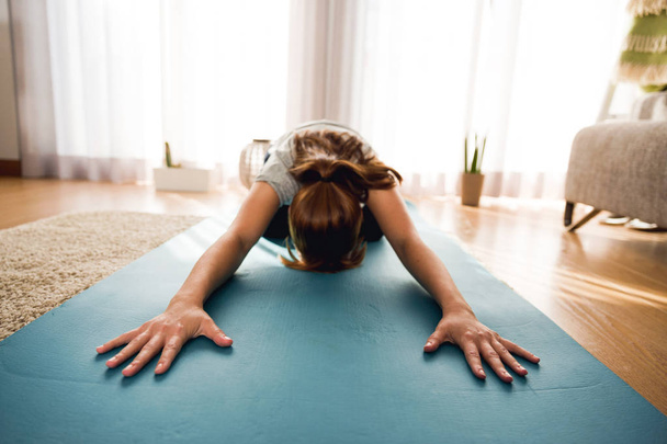 woman doing stretching exercise at home - Photo, Image