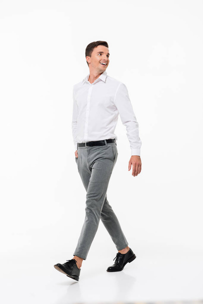 Full length portrait of a happy smiling man in a white shirt - Foto, Bild