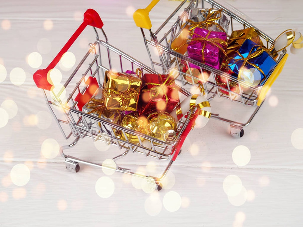 Christmas discount, Little shopping cart full of christmas gifts, Shopping trolley with gift boxes - Photo, Image