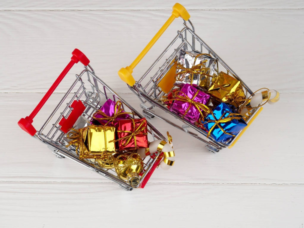 Christmas discount, Little shopping cart full of christmas gifts, Shopping trolley with gift boxes - Photo, Image