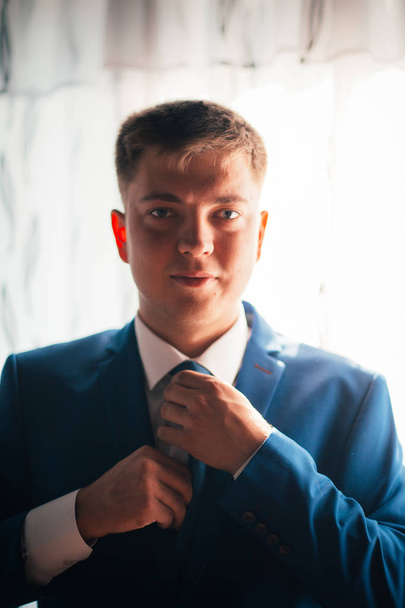 portrait of the groom on a light background - Photo, Image