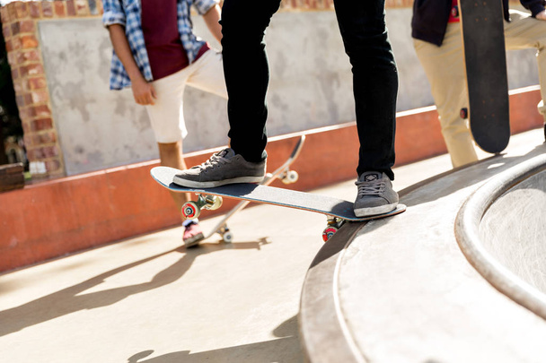 Teenage boy skateboarding outdoors - Photo, Image
