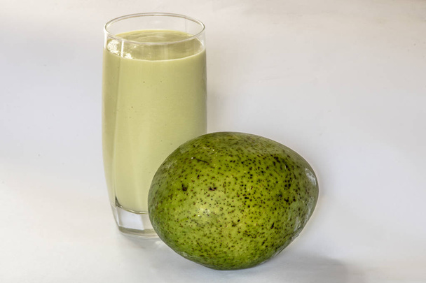 Isolated avocado smoothie in white background - Photo, Image