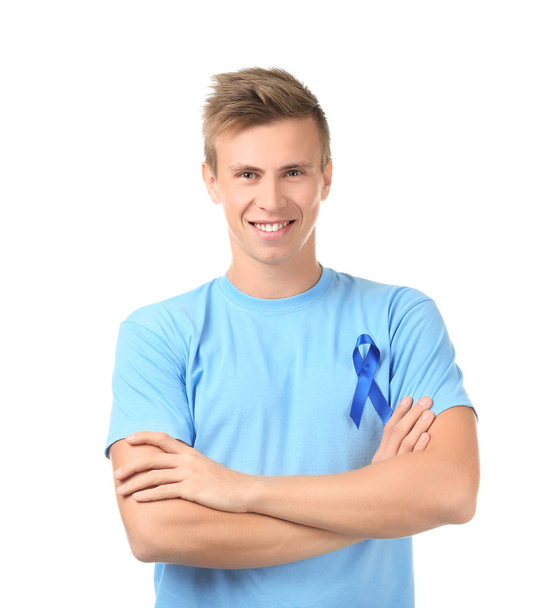 Young man wearing shirt with blue ribbon  - 写真・画像