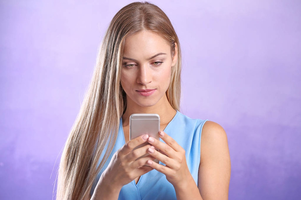 Young woman using smartphone - Photo, image