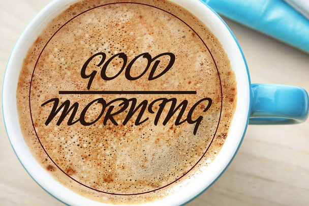 Text GOOD MORNING over cup of coffee - Foto, imagen