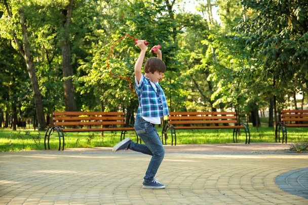 Cute little boy jumping rope  - Φωτογραφία, εικόνα