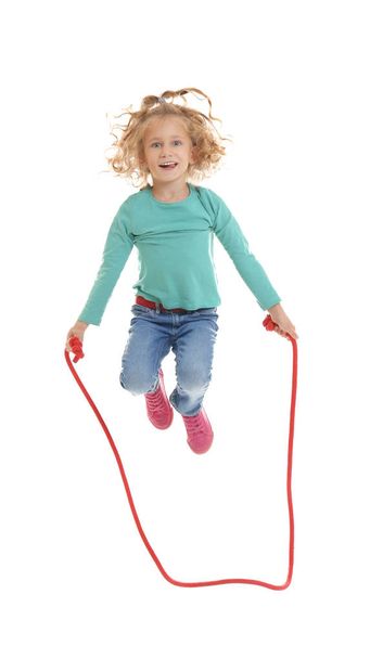Cute girl skipping rope on white background - Fotoğraf, Görsel