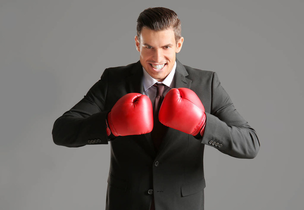 Businessman in boxing gloves  - Valokuva, kuva
