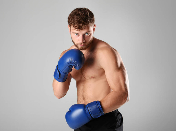 Male boxer on background - Φωτογραφία, εικόνα