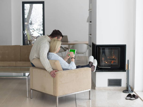 Young Couple in front of fireplace - Foto, immagini