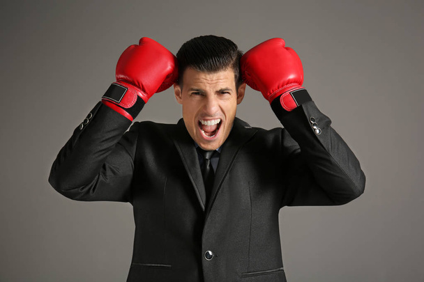 Businessman in boxing gloves  - Φωτογραφία, εικόνα