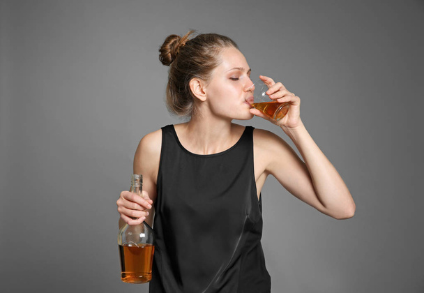 Young woman drinking alcohol  - Photo, image