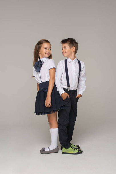  kids dressed in school uniform posing - Foto, afbeelding