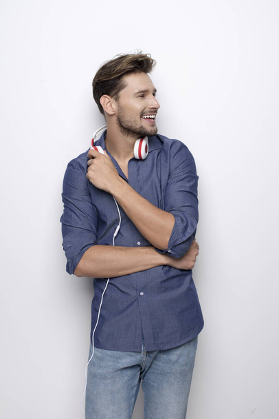 man with headphones posing at camera - Fotó, kép