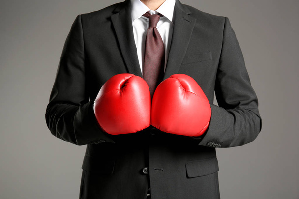 Businessman in boxing gloves  - Фото, зображення