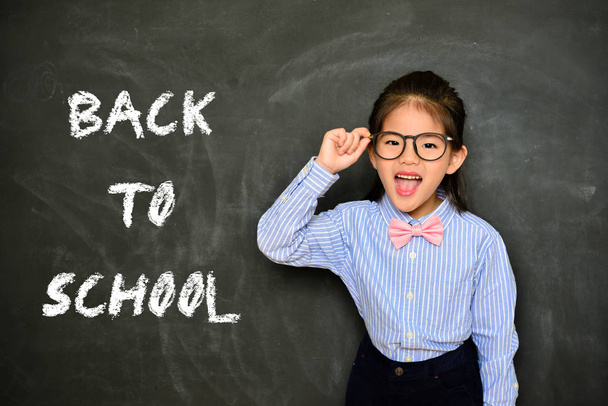 back to school concept with cheerful small teacher - Photo, Image