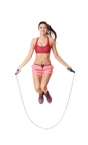 Young woman with jumping rope - Valokuva, kuva