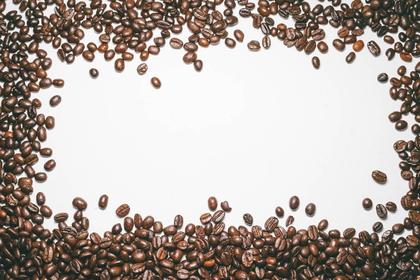 fragrant coffee beans on white background. a frame of brown beans - Φωτογραφία, εικόνα