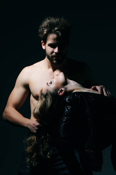 Macho with fit torso hold woman on long hair - Foto, immagini