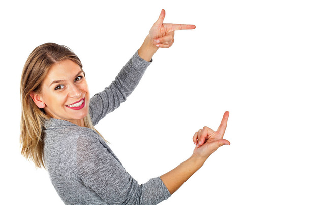  Happy woman pointing to copy space - Foto, Imagen