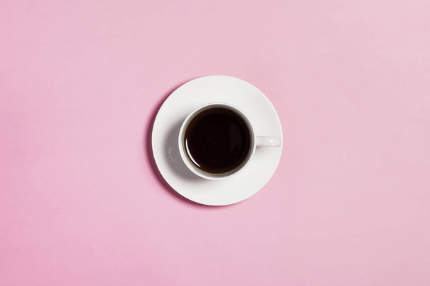 coffee cup on pink background. - Фото, изображение