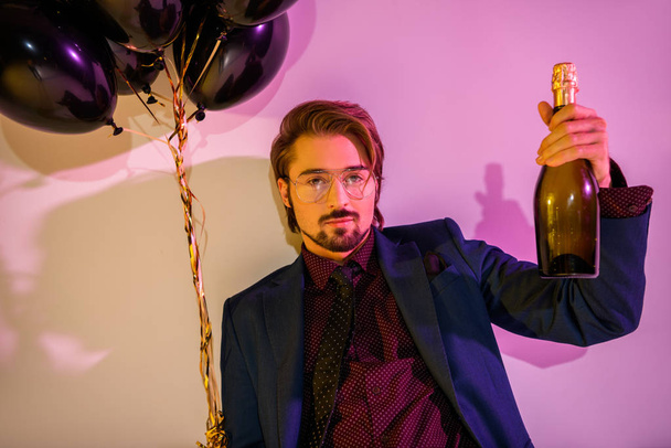 man with champagne and balloons - Photo, image