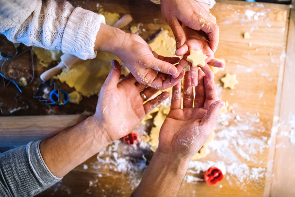 Young family making cookies at home. - 写真・画像