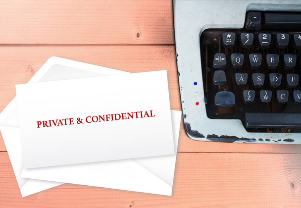Private and confidential on envelop stack with typewriter, vintage love concept - Photo, Image