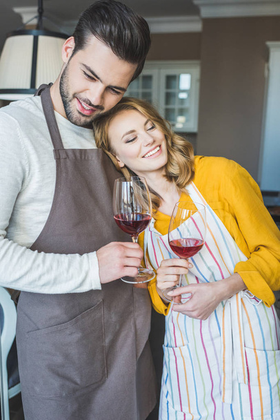 Young couple having a glass of wine - Φωτογραφία, εικόνα